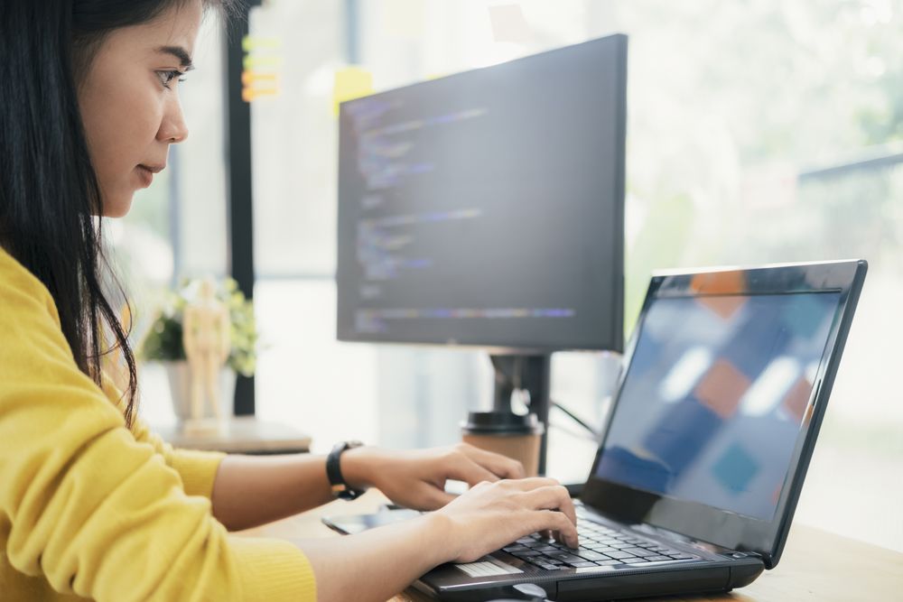 woman at her computer working out how to achieve client source IP transparency